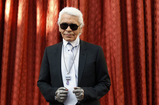 German designer Karl Lagerfeld wear's the Commander's Cross of the Legion of Honour he received from France's President Nicolas Sarkozy at a ceremony at the Elysee Palac