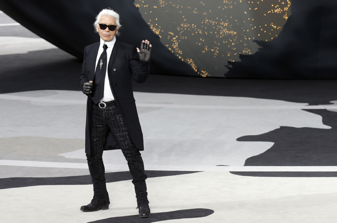 German designer Lagerfeld appears at the end of his Fall-Winter 2013/2014 women's ready-to-wear fashion show for French fashion house Chanel during Paris fashion week