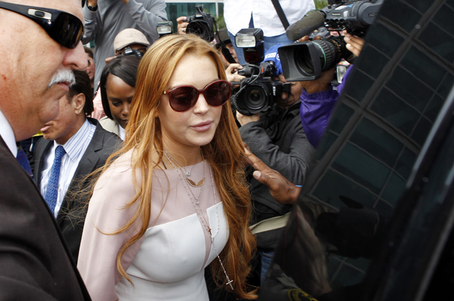Actress Lindsay Lohan departs from court after a plea deal at the Airport Branch of the Los Angeles Superior Courthouse in Los Angeles