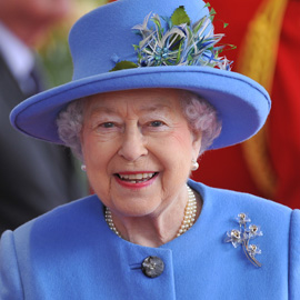 Britain's Queen Elizabeth smiles as she welcomes the President of Ireland Michael D. Higgins outside Windsor Castle in Windsor
