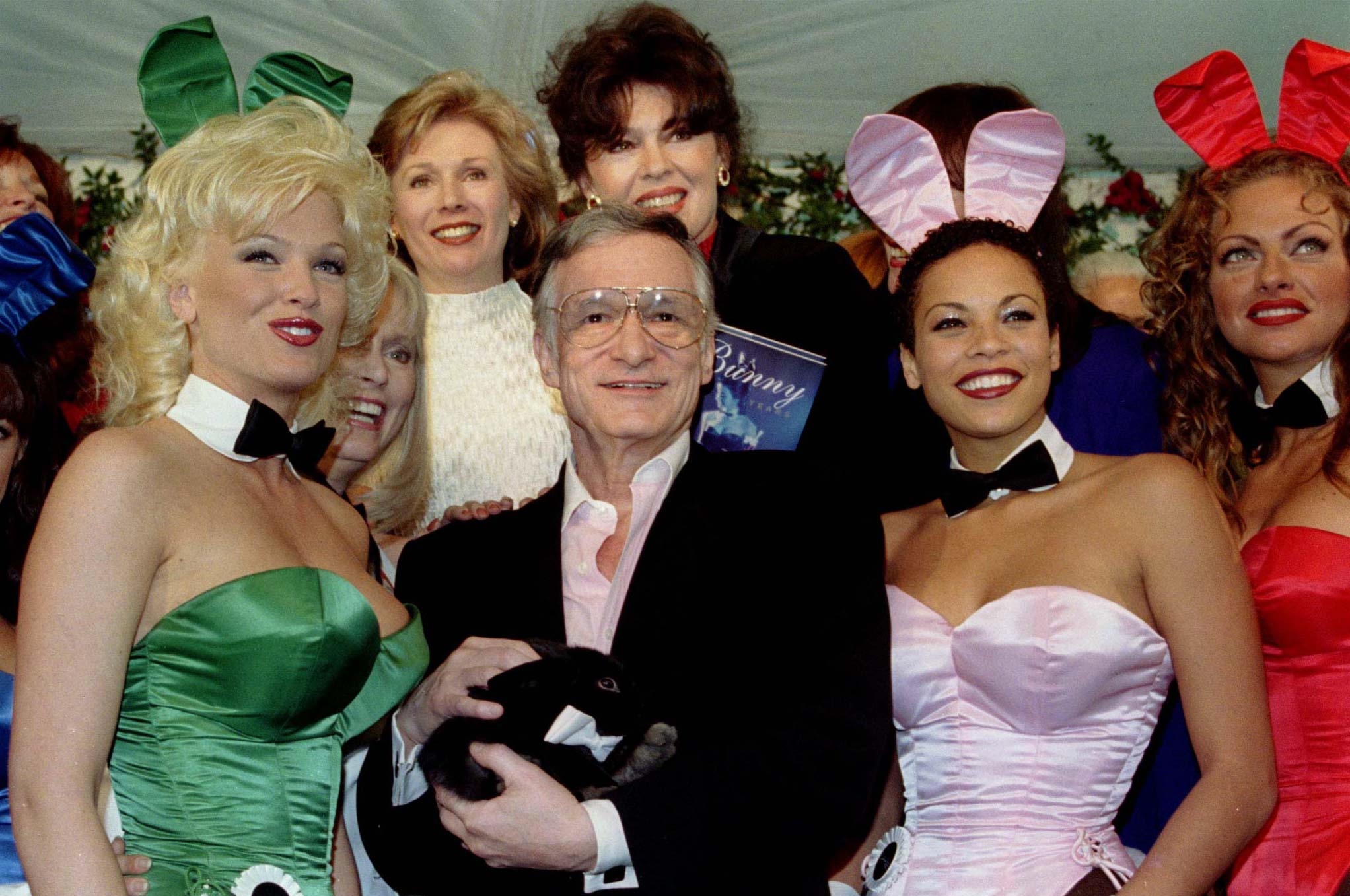 Hugh Hefner (C) , founder and publisher of Playboy magazine, is surrounded by former and present Playmates, as he holds a pet rabbit given to him for his 72nd birthday, April 9, at the Playboy Mansion in Los Angeles. Hefner was a struggling young magazine copywriter in 1953 when he turned a $600 investment and a picture of Marilyn Monroe into one of the most successful publishing empires in history. - RTXIFAD