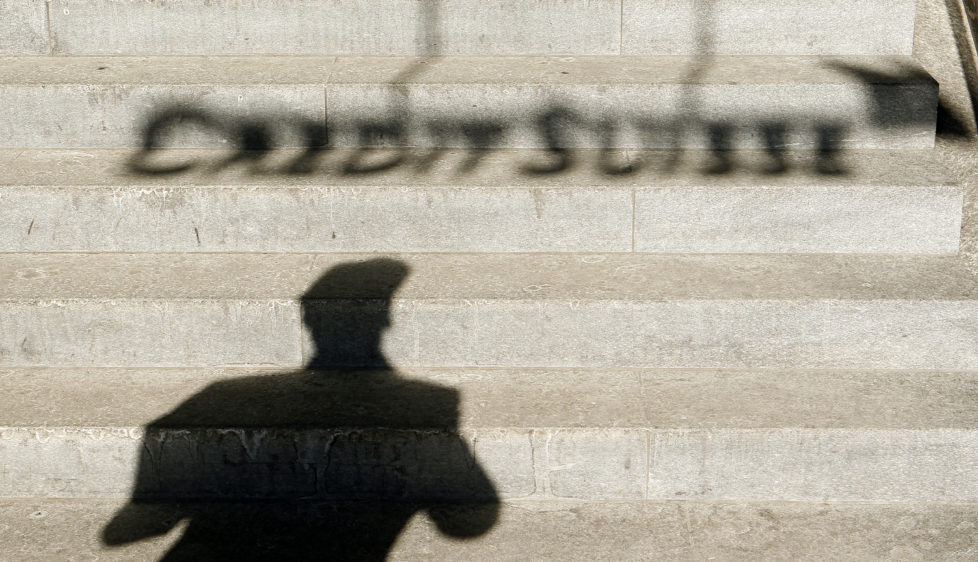 A the shadow of a man and of the logo of Swiss bank Credit Suisse are thrown on stairs in Zurich February 6, 2012. J REUTERS/Arnd Wiegmann (SWITZERLAND - Tags: BUSINESS) - RTR2XEHT