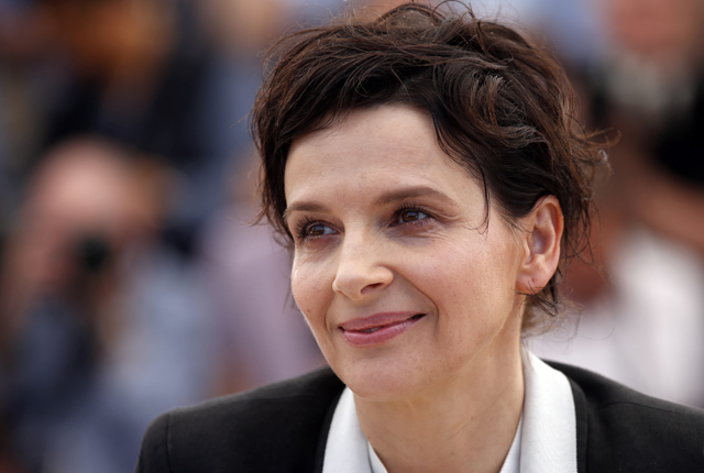 Cast member Juliette Binoche poses during a photocall for the film "Sils Maria" in competition at the 67th Cannes Film Festival in Cannes