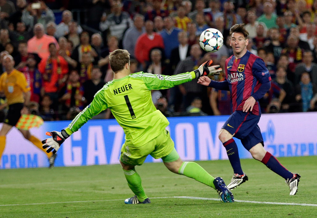 Barcelona's Lionel Messi, right, scores his second goal past Bayern's goalkeeper Manuel Neuer during the Champions League semifinal first leg soccer match between Barcelona and Bayern Munich at the Camp Nou stadium in Barcelona, Spain, Wednesday, May 6, 2015. (AP Photo/Emilio Morenatti)