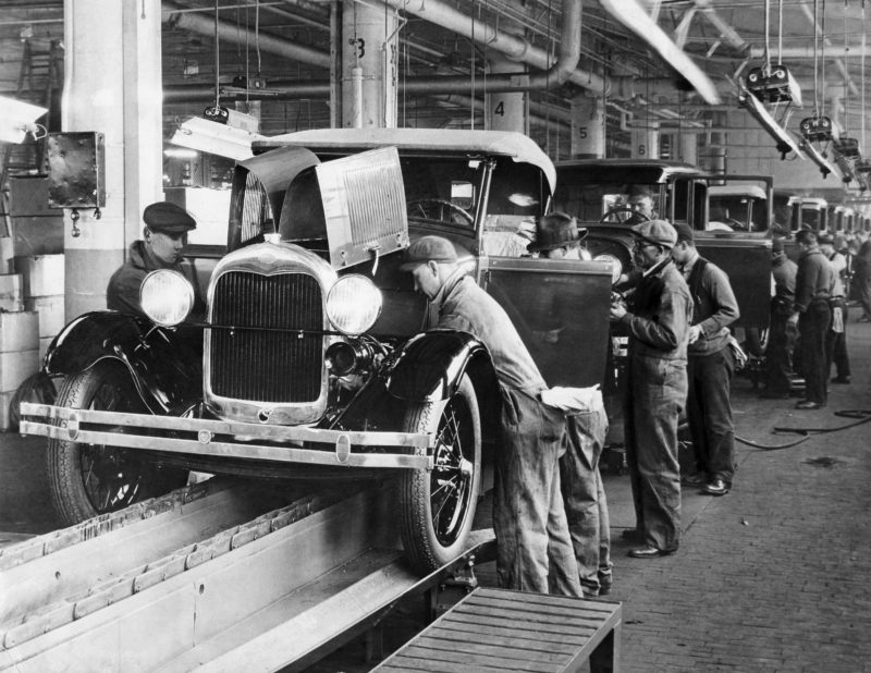 (GERMANY OUT) USA Michigan : Ford Motor Company in Dearborn / Detroit: work on the assembly line - around 1934 - Vintage property of ullstein bild (Photo by ullstein bild/ullstein bild via Getty Images)