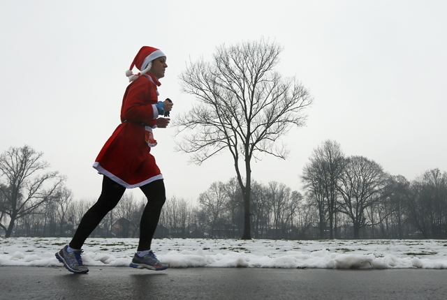 A costumed runner participates in the "Santa Claus Run" in Mogosoaia, near Bucharest