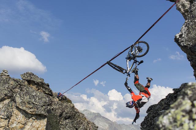 Kenny Belaey falls while attempting to cross the rock gap on a high line during his Balance project in La Plagne, France on July 13th, 2015 // Dom Daher/Red Bull Content Pool // P-20150916-00100 // Usage for editorial use only // Please go to www.redbullcontentpool.com for further information. //