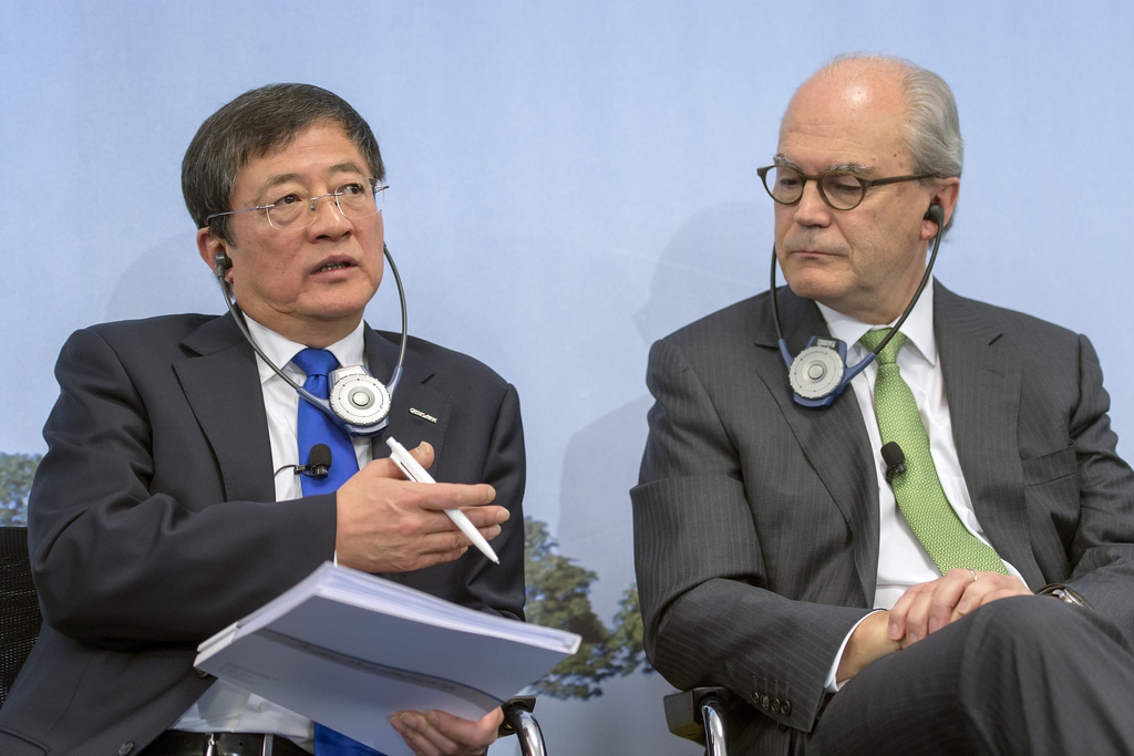 Ren Jianxin, Chairman of ChemChina (China National Chemical Corporation), left, and Michel Demare, Chairman of the Board, right, spaek during the annual press conference of agrochemical company Syngenta in Basel on Wednesday, February 3, 2016. Syngenta announced that ChemChina has offered to acquire the company at a value of over US Dollars 43 billion. (KEYSTONE/Georgios Kefalas)