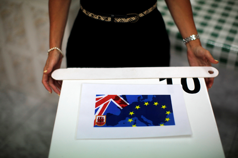 A member of a polling station stands next to a polling box as she waits for citizens during the EU referendum in the British overseas territory of Gibraltar, historically claimed by Spain, June 23, 2016. REUTERS/Jon Nazca - RTX2HSCL