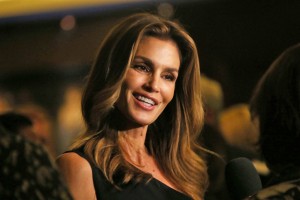 Model Cindy Crawford poses for photographs on arrival at her book launch at the Beaumont Hotel in central London, Thursday, Oct 1, 2015. (Photo by Joel Ryan/Invision/AP)