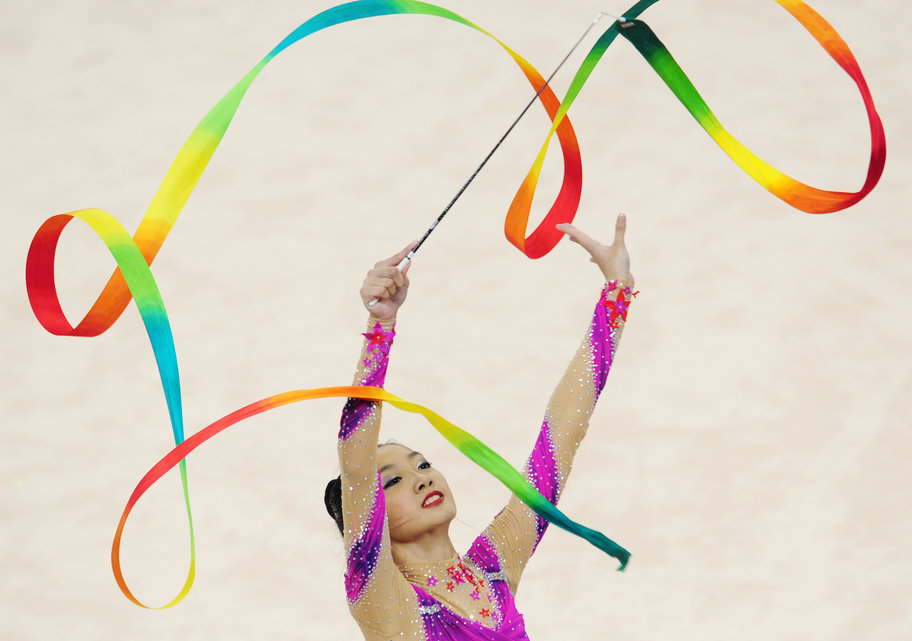 Tong Kah Mun of Singapore performs her ribbon routine during the gymnastics rhythmic individual all round final at the 28th Southeast Asian Games (SEA Games) in Singapore on June 14, 2015.    AFP PHOTO / MOHD FYROL