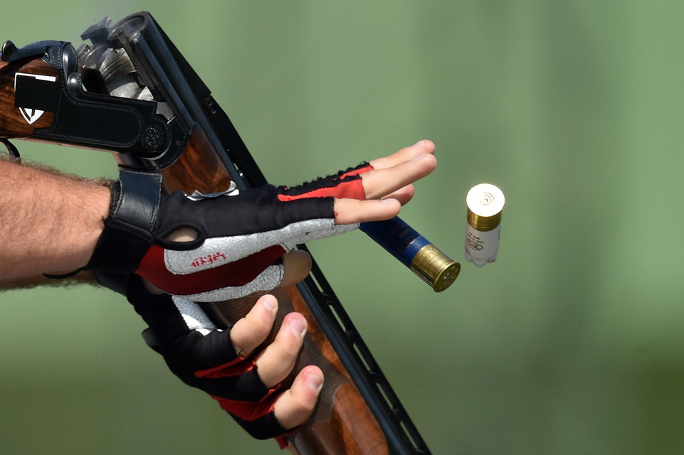 Italy's Davide Gasparini competes in the men's double trap qualification at the 2015 European Games in Baku on June 19, 2015. AFP PHOTO / KIRILL KUDRYAVTSEV