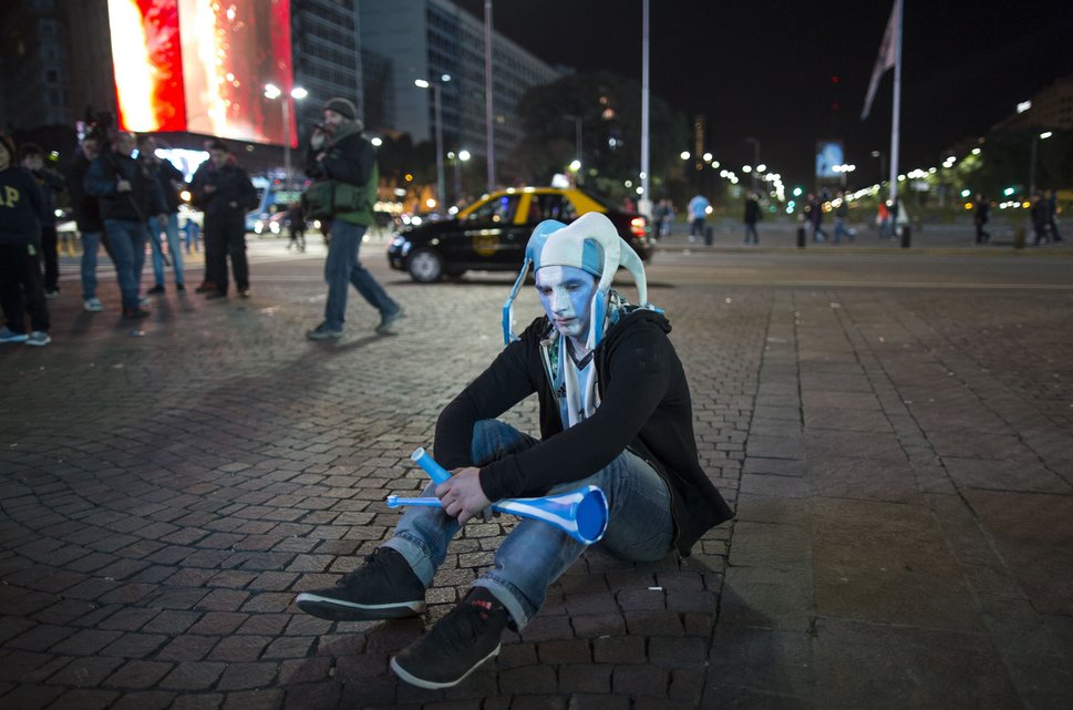 An Argentina soccer fan sits on the sidewalk after watching his team loose the final Copa America match to Chile, in downtown Buenos Aires, Argentina, Saturday, July 4, 2015. Argentina lost in a penalty shootout. (AP Photo/Ivan Fernandez)