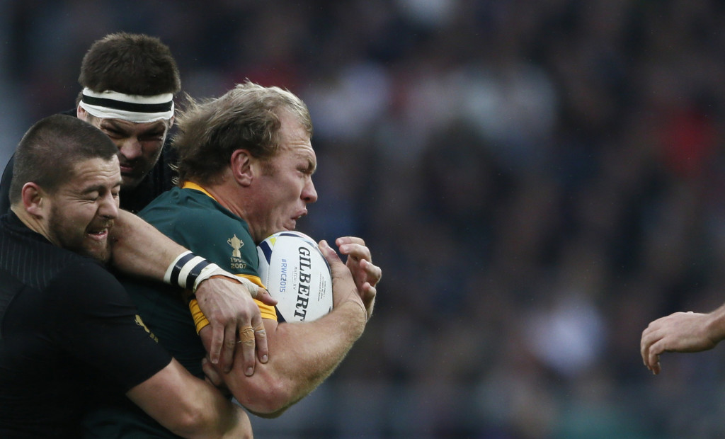 Schalk Burger of South Africa (R) is tacked by Richie McCaw of New Zealand (C) during their Rugby World Cup Semi-Final match at Twickenham in London, Britain, October 24, 2015. REUTERS/Stefan Wermuth TPX IMAGES OF THE DAY - RTX1T1D6