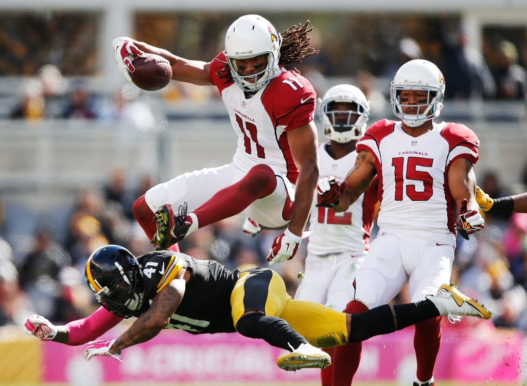PITTSBURGH, PA - OCTOBER 18: Larry Fitzgerald #11 of the Arizona Cardinals leaps over Antwon Blake #41 of the Pittsburgh Steelers in the 1st half of the gmae at Heinz Field on October 18, 2015 in Pittsburgh, Pennsylvania. (Photo by Gregory Shamus/Getty Images) *** BESTPIX ***