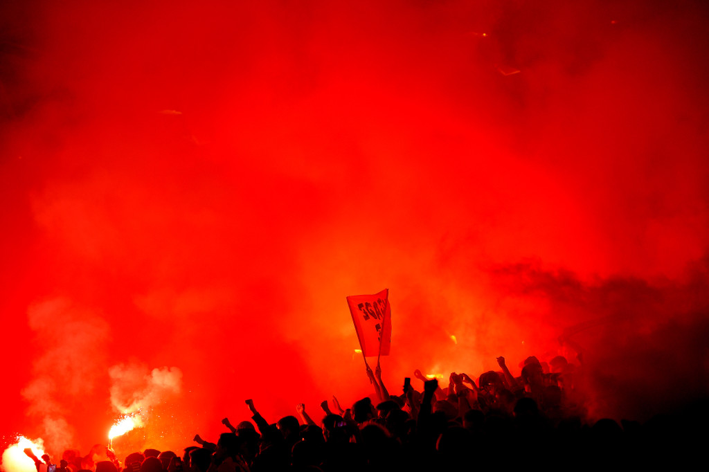 Nantes' supporters light flares during the French L1 football match between Nantes and Marseille at the Beaujoire stadium in Nantes, western France, on November 1, 2015. AFP PHOTO / JEAN-SEBASTIEN EVRARD