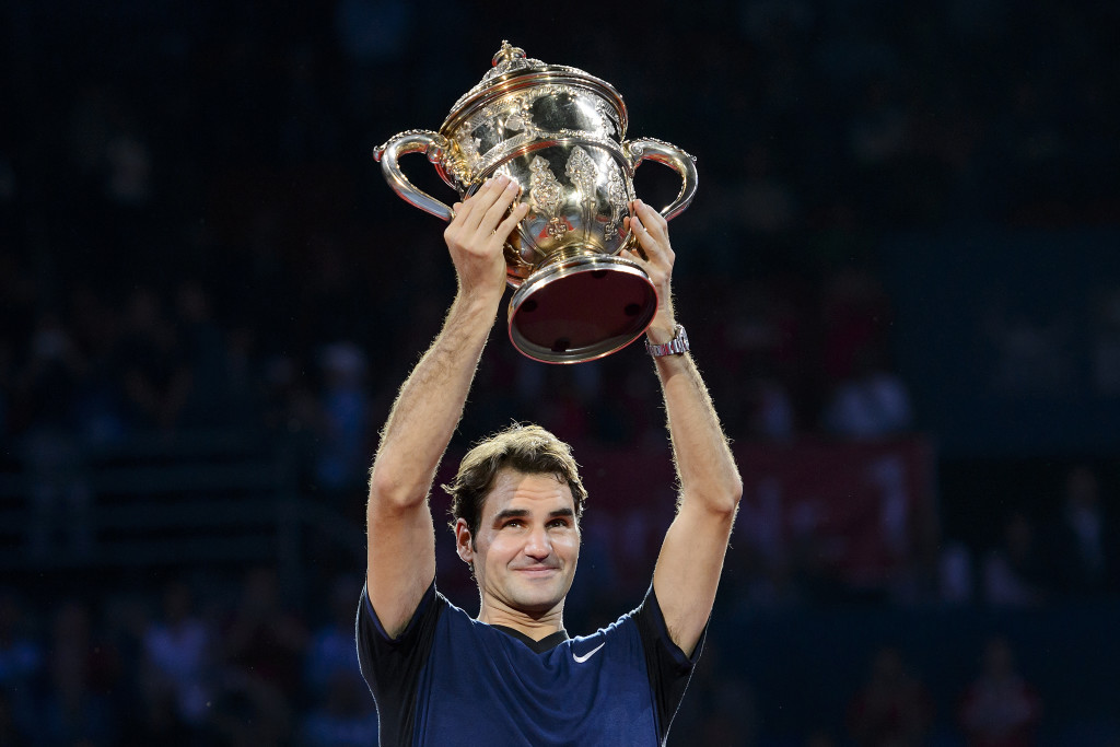 Switzerland's Roger Federer raises his trophy as he celebrates his victory against Spain's Rafael Nadal after their final match at the Swiss Indoors tennis tournament on November 1, 2015 in Basel, northern Switzerland. AFP PHOTO / FABRICE COFFRINI