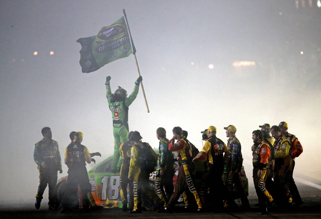 HOMESTEAD, FL - NOVEMBER 22: Kyle Busch, driver of the #18 M&M's Crispy Toyota, celebrates with his crew after winning the series championship and the NASCAR Sprint Cup Series Ford EcoBoost 400 at Homestead-Miami Speedway on November 22, 2015 in Homestead, Florida. (Photo by Mike Ehrmann/Getty Images) ***BESTPIX***