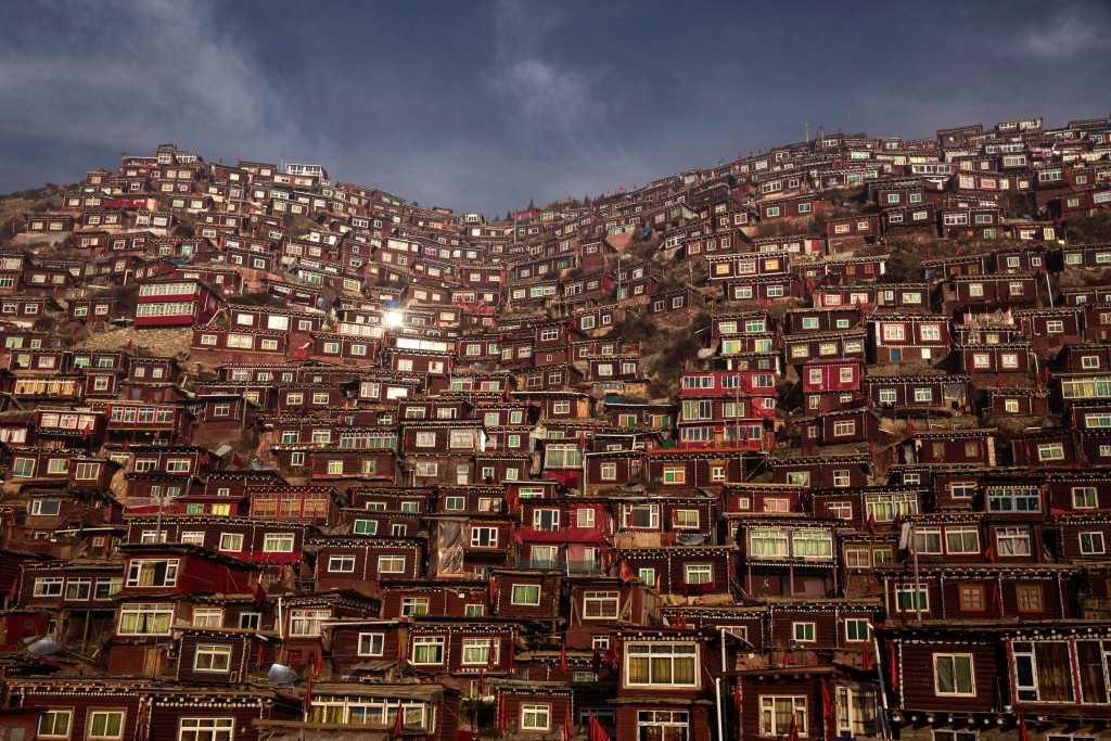 SERTAR, CHINA - OCTOBER 30: Dwellings where Tibetan Buddhist nuns and monks live are seen on a hillside at Larung Wuming Buddhist Institute on October 30, 2015 in Sertar county, in the remote Garze Tibetan Autonomous Prefecture, Sichuan province, China. Located high in the mountains of Sichuan, the Larung Wuming Buddhist Institute was founded in 1980 by an influential lama of the Nyingma sect and is widely regarded as the world's largest and most influential centre for Tibetan Buddhist studies. The school is home to thousands of monks and nuns and is popular for followers from all over the Tibetan areas and other parts of China. (Photo by Kevin Frayer/Getty Images)