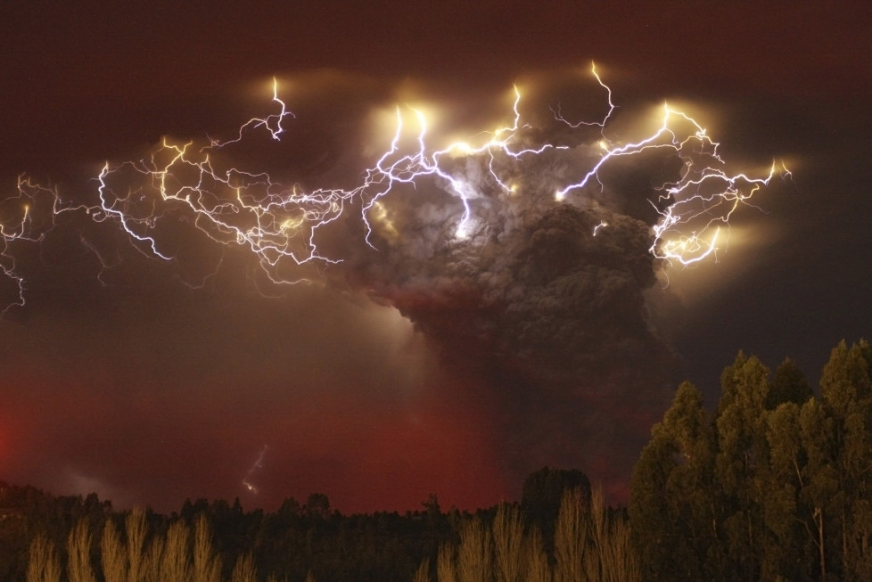 Lightning flashes around the ash plume at above the Puyehue-Cordon Caulle volcano chain near Entrelagos June 5, 2011. The volcano in the Puyehue-Cordon Caulle chain, dormant for decades, erupted in south-central Chile on Saturday, belching ash over 6 miles (10 km) into the sky, as winds fanned it toward neighboring Argentina, and prompted the government to evacuate several thousand residents, authorities said. Picture taken June 5. REUTERS/Carlos Gutierrez (CHILE - Tags: ENVIRONMENT DISASTER IMAGES OF THE DAY) FOR BEST QUALITY IMAGE: ALSO SEE GM1E77L02MK01. - RTR2NDD9