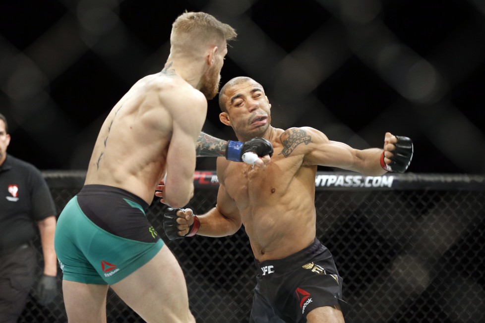 Conor McGregor knocks out Jose Aldo during a featherweight championship mixed martial arts bout at UFC 194, Saturday, Dec. 12, 2015, in Las Vegas. (AP Photo/John Locher)