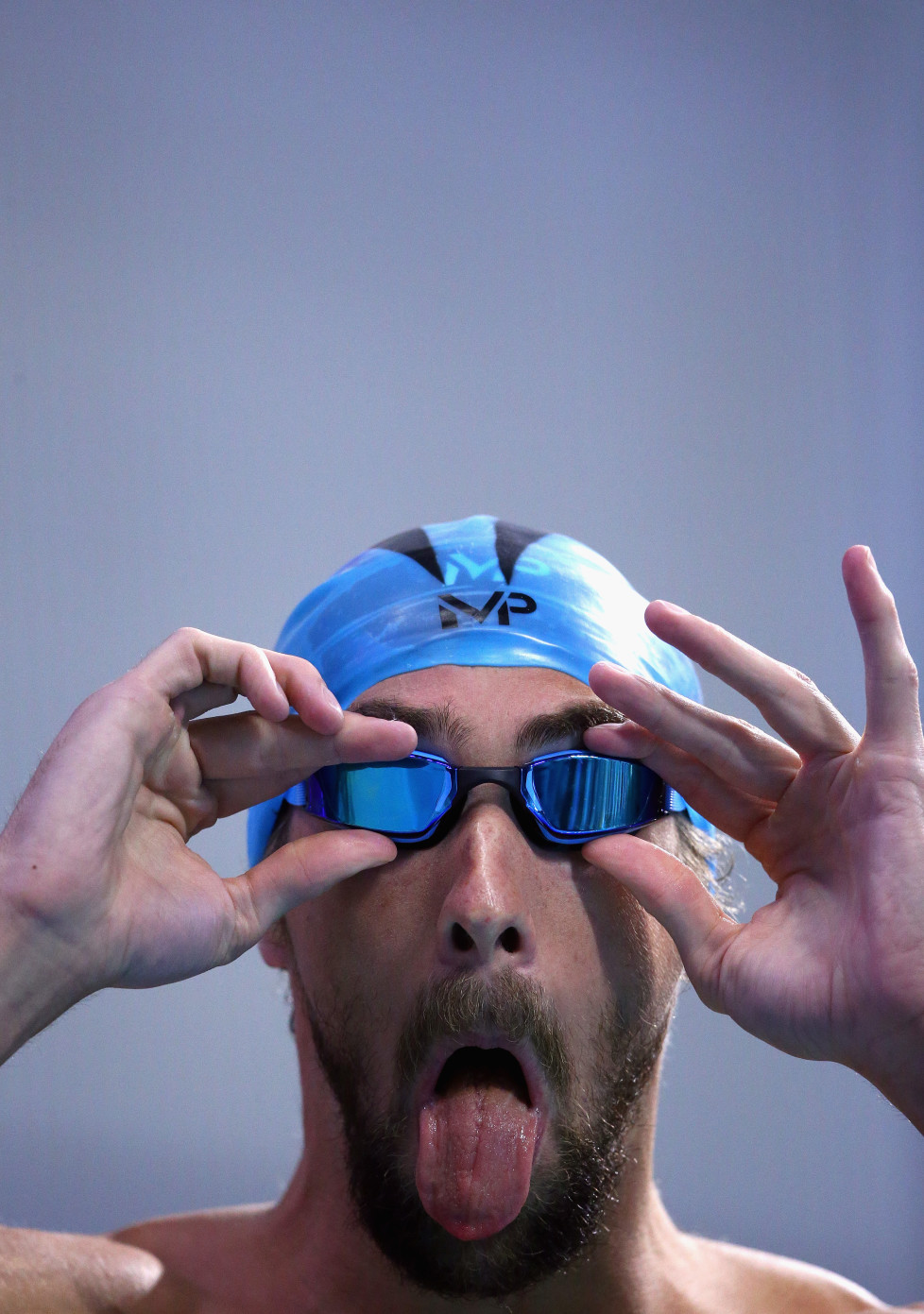 AUSTIN, TX - JANUARY 15: Michael Phelps adjusts his googles before competing in the Men's 100 meter butterfly final during the Arena Pro Swim Series at Austin on January 15, 2016 in Austin, Texas. (Photo by Ronald Martinez/Getty Images)