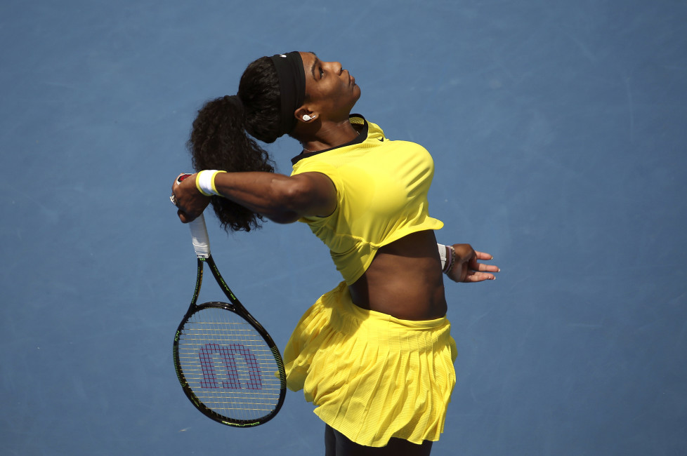 Serena Williams of the U.S. serves during her first round match against Italy's Camila Giorgi at the Australian Open tennis tournament at Melbourne Park, Australia, January 18, 2016. REUTERS/Jason O'Brien TPX IMAGES OF THE DAY - RTX22T77