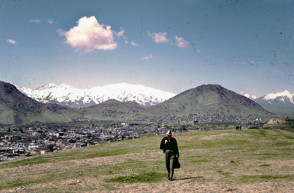 "Dr. Bill Podlich on a hillside in Kabul. "My dad was a professor of Elementary Education, specializing in teaching Social Studies, at Arizona State University in Tempe, Arizona from 1949 until he retired in 1981. He had always said that since he had served in WWII (he trained soldiers against chemical warfare), he wanted to serve in the cause of peace. In 1967, he was hired by UNESCO as an Expert on Principles of Education, for a two-year stint in Kabul, Afghanistan at the Higher TeachersÕ College. Throughout his adult life, because he was interested in social studies, whenever he traveled around (in Arizona, to Mexico and other places), he continued to take pictures. In Afghanistan he took half-frame color slides (on Kodachrome), and I believe he used a small Olympus camera." - Peg Podlich."