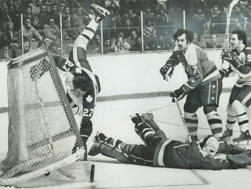 CANADA - DECEMBER 01: Scoring With A Flair: Leafs' Darryl Sittler (27) turns a somersault and knocks goal posts off supports after scoring one of two goals in Saturday night's game against Washington Capitals at the Gardens. Caps' goalie Ron Low is sprawled along ice while teammate Yvon Labre (7) looks on with dismay and Leafs' Norm Ullman seems surprised by Sittler's tumble. Sittler was unhurt as Leafs went on to 7-1 win. Toronto game last night in Detroit was snowed out. (Photo by Ron Bull/Toronto Star via Getty Images)