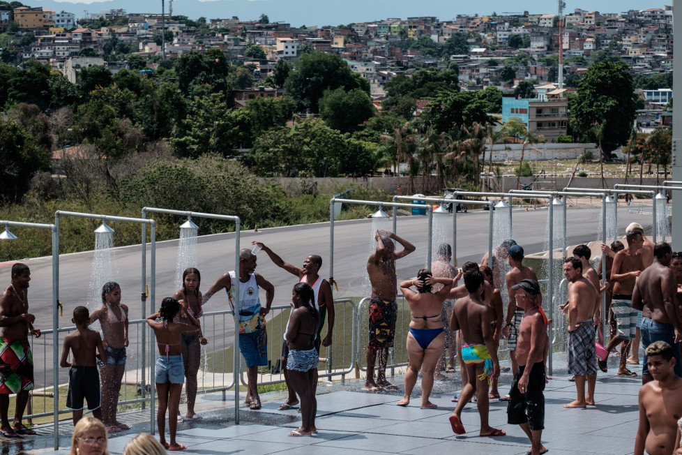 People enjoy the Whitewater Stadium built at Deodoro's X-Park for the Rio 2016 Olympic Games in Rio de Janeiro, Brazil, on February 28, 2016. The venue was opened to the public in late 2015 and will be closed Tuesday to deliver the stadium to the Olympic Committee. The Whitewater Stadium will host the canoe slalom events during the Olympic Games. AFP PHOTO / YASUYOSHI CHIBA / AFP / YASUYOSHI CHIBA