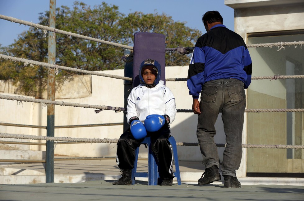 REFILE - CLARIFYING NAME OF BOXING CLUBAamna, 11, waits for the start for her bout during the Sindh Junior Sports Association Boxing Tournament in Karachi, Pakistan February 21, 2016. For the past six months about a dozen girls, aged 8 to 17, have gone to the Pak Shaheen Boxing Club after school to practice their jabs, hooks and upper cuts. Pakistani women have been training as boxers in small numbers and competed in the South Asian Games last year, said Younis Qambrani, the coach who founded the club in 1992 in the Karachi neighbourhood of Lyari, better known for internecine gang warfare than for breaking glass ceilings. REUTERS/Akhtar Soomro SEARCH "THE WIDER IMAGE" FOR ALL STORIES