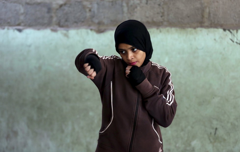 REFILE - CLARIFYING NAME OF BOXING CLUBMisbah, 17, takes part in warm up exercises at the first women's boxing coaching camp in Karachi, Pakistan February 19, 2016. For the past six months about a dozen girls, aged 8 to 17, have gone to the Pak Shaheen Boxing Club after school to practice their jabs, hooks and upper cuts. Pakistani women have been training as boxers in small numbers and competed in the South Asian Games last year, said Younis Qambrani, the coach who founded the club in 1992 in the Karachi neighbourhood of Lyari, better known for internecine gang warfare than for breaking glass ceilings. REUTERS/Akhtar Soomro SEARCH "THE WIDER IMAGE" FOR ALL STORIES