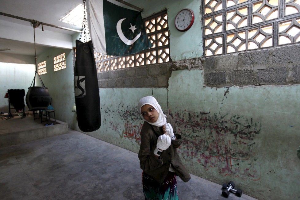 REFILE - CLARIFYING NAME OF BOXING CLUBMehek, 15, who has her hands wrapped, takes part in an exercise session at the first women's boxing coaching camp in Karachi, Pakistan February 19, 2016. For the past six months about a dozen girls, aged 8 to 17, have gone to the Pak Shaheen Boxing Club after school to practice their jabs, hooks and upper cuts. Pakistani women have been training as boxers in small numbers and competed in the South Asian Games last year, said Younis Qambrani, the coach who founded the club in 1992 in the Karachi neighbourhood of Lyari, better known for internecine gang warfare than for breaking glass ceilings. REUTERS/Akhtar Soomro SEARCH "THE WIDER IMAGE" FOR ALL STORIES TPX IMAGES OF THE DAY