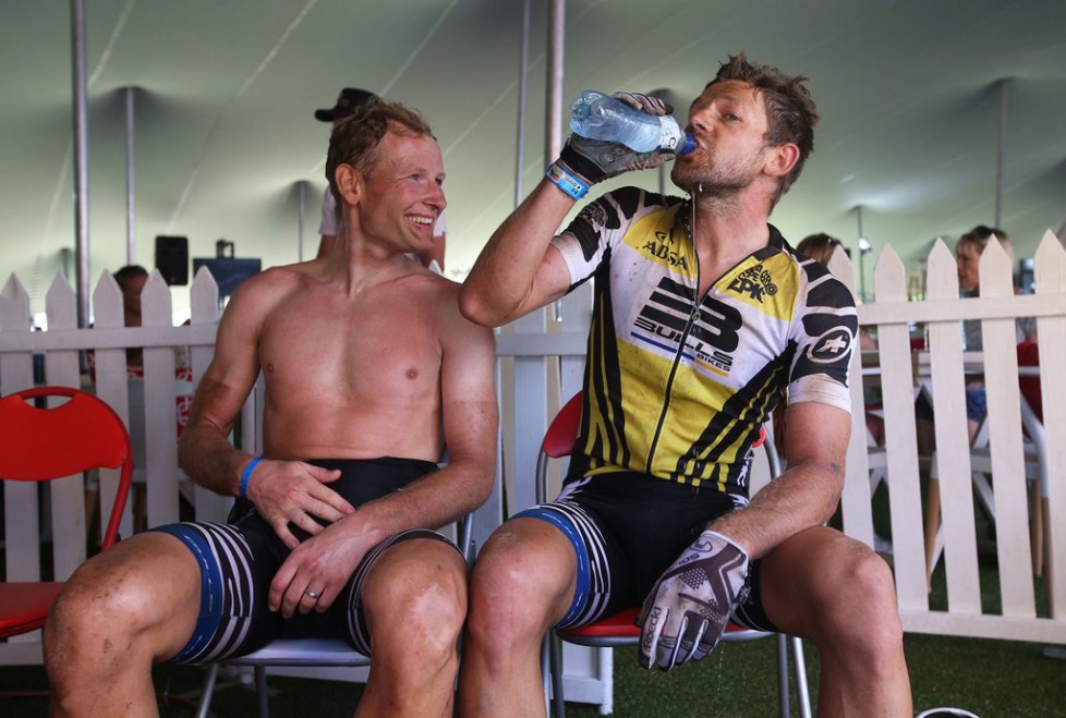 epa05217989 Swiss rider Urs Huber (L) and Germany's Karl Platt (R) of Team Bulls rest after the 95km Stage 5 of the 2016 ABSA Cape Epic mountain bike race near Boschendal, South Africa, 18 March 2016. The ABSA Cape Epic is often described as the 'Tour de France' of mountain biking and will see 1,200 riders racing over 652km in eight stages and 15,100m of climbing. UCI professional racers ride alongside amateur riders during the eight day long race. EPA/KIM LUDBROOK
