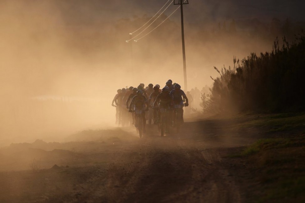 epa05210794 The peleton ride in the morning sun in the early part of the 108km Stage 1 of the 2016 ABSA Cape Epic mountain bike race in Saronsberg South Africa, 14 March 2016. The ABSA Cape Epic is often described as the 'Tour de France' of mountain biking and will see 1,200 riders racing over 652km in eight stages and 15,100m of climbing. UCI professional racers ride alongside amateur riders during the eight day long race. EPA/KIM LUDBROOK