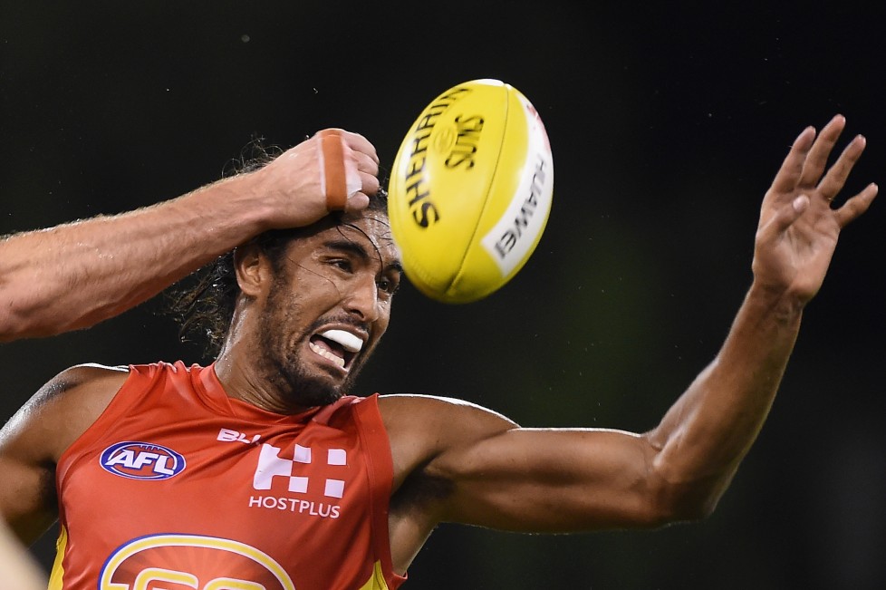 GOLD COAST, QUEENSLAND - APRIL 09: Tom Nicholls of the Suns competes for the ball during the round three AFL match between the Gold Coast Suns and the Carlton Blues at Metricon Stadium on April 9, 2016 on the Gold Coast, Australia. (Photo by Matt Roberts/AFL Media/Getty Images)