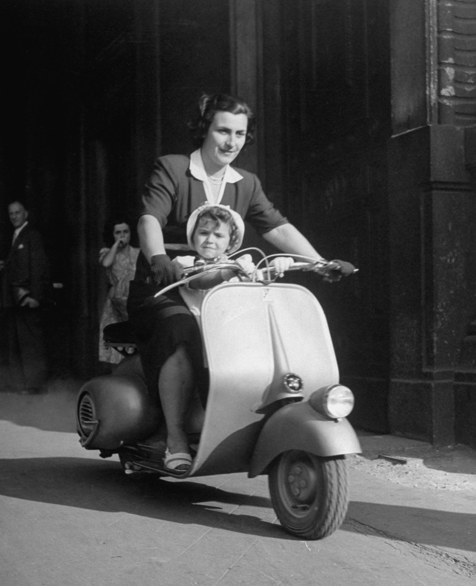 Mother and baby riding a Vespa scooter. (Photo by Dmitri Kessel/The LIFE Picture Collection/Getty Images)