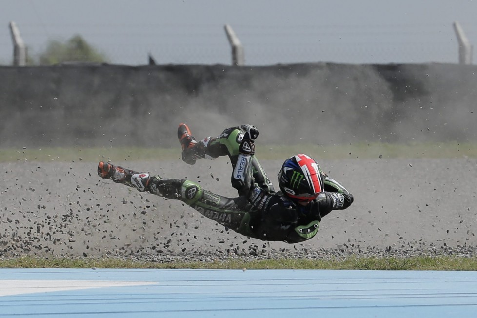 In this Saturday, April 2, 2016 photo, British rider Bradley Smith flies off his Yamaha after falling on Turn 1, during the Moto GP qualifying session at the Termas de Rio Hondo circuit, in Argentina. (AP Photo/Victor R. Caivano)