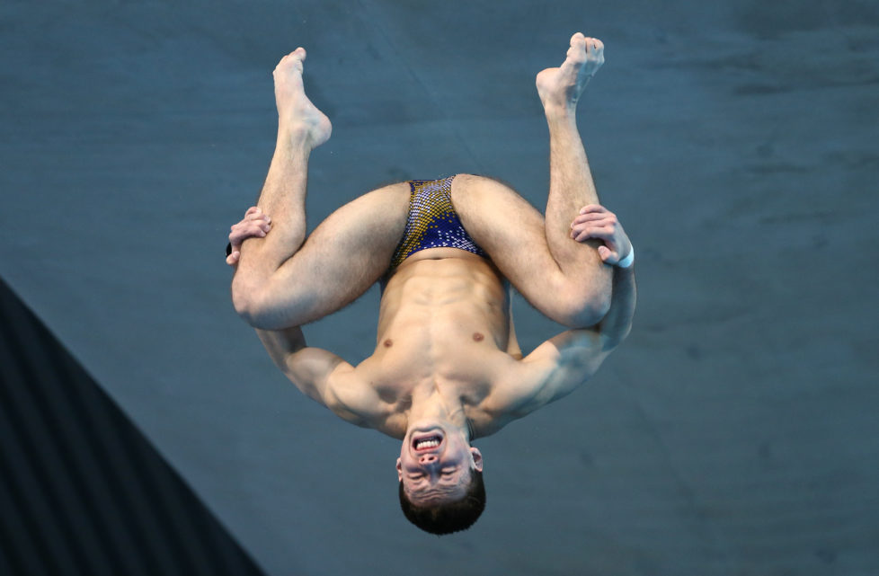 Ukraine's Maksym Dolgov competes in the final of the men's Platform diving event on Day 7 of the European aquatics championships in London on May 15, 2016. / AFP PHOTO / JUSTIN TALLIS