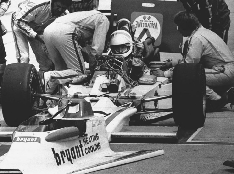FILE - In this May 29, 1977 file photo, Janet Guthrie, the first woman to enter the Indianapolis 500 auto race, is shown in her car as her pit crew works prior to the 61st running of the Indianapolis 500 auto race in Indianapolis, Ind. (AP Photo/File)