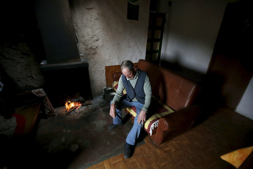 Fernando rests on a sofa inside his house in Povoa de Agracoes, near Chaves, Portugal April 19, 2016. In the villages of Agracoes and Povoa de Agracoe the steady drip-drip of emigration has brought down population numbers from more than 50 residents to fewer than a dozen each. These remaining villagers share the same glum acceptance that, after they have gone, their villages will die out too. It is the same desolate picture in scores of other backwater settlements in Portugal's interior, north to south. REUTERS/Rafael Marchante SEARCH "ABANDONED PORTUGAL" FOR THIS STORY. SEARCH "THE WIDER IMAGE" FOR ALL STORIES