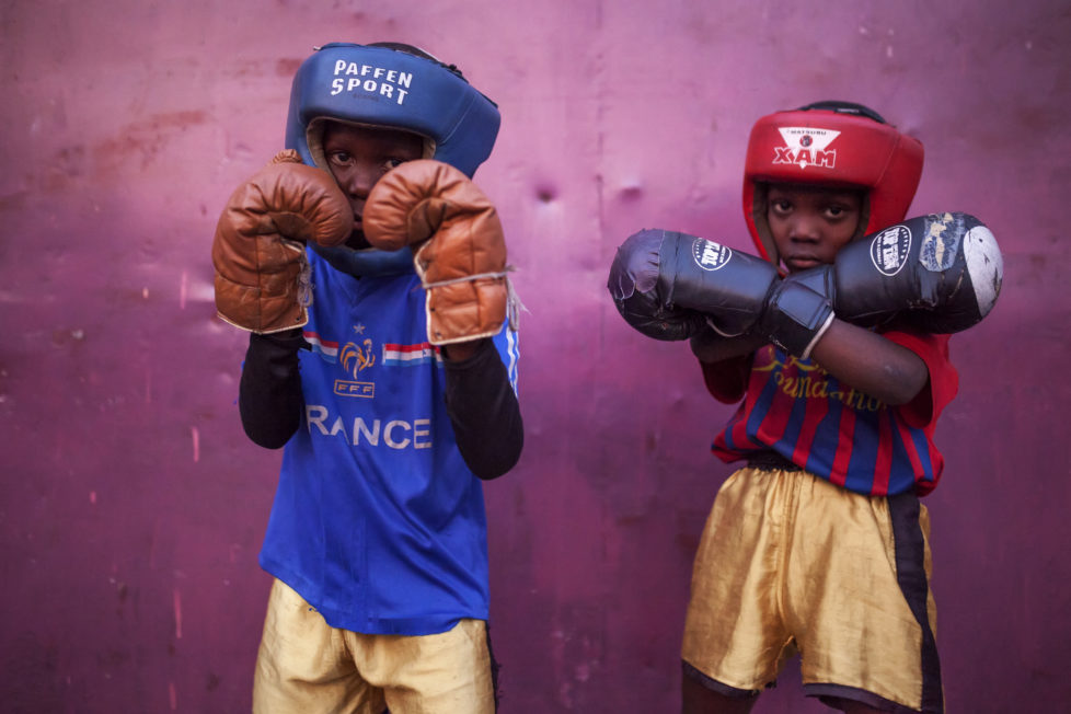 David Samba (l) and Onomo Mugabi train at the "Muhammad Ali's head high" ("La Tete Haute de Mohamed Ali") Boxing Club in Kinshasa on June 4, 2016. The club is located at the Tata Raphael Stadium of Kinshasa, the place where the historic boxing event "Rumble in the Jungle" took place between Muhammad Ali and George Foreman the 30th of October of 1974. / AFP PHOTO / EDUARDO SOTERAS