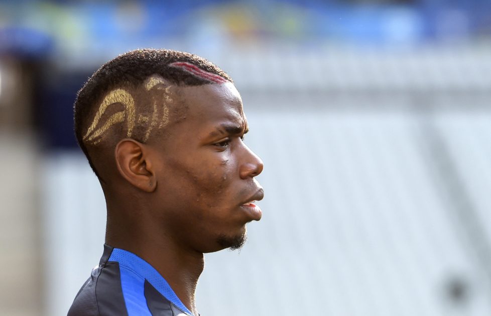 epa05353560 France national soccer team player Paul Pogba takes part in a training session at the Stade de France in Saint-Denis, France, 09 June 2016. France will face Romania in the opening match of the UEFA EURO 2016 soccer championship at the Stade de France on 10 June. (RESTRICTIONS APPLY: For editorial news reporting purposes only. Not used for commercial or marketing purposes without prior written approval of UEFA. Images must appear as still images and must not emulate match action video footage. Photographs published in online publications (whether via the Internet or otherwise) shall have an interval of at least 20 seconds between the posting.) EPA/GEORGI LICOVSKI