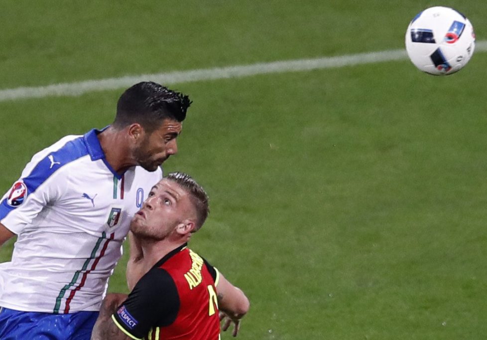 Italy's Graziano Pelle fights for the ball against Belgium's Toby Alderweireld during the Euro 2016 Group E soccer match between Belgium and Italy at the Grand Stade in Decines-Charpieu, near Lyon, France, Monday, June 13, 2016. (AP Photo/Michael Sohn)