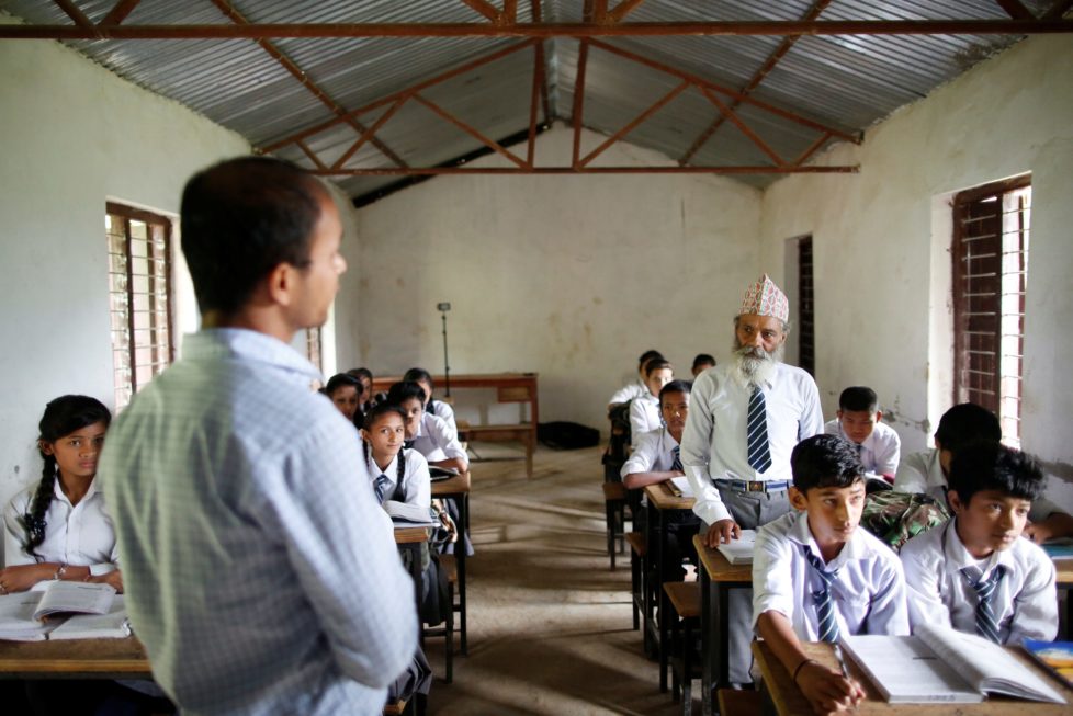 Durga Kami, 68, who is studying in tenth grade at Shree Kala Bhairab Higher Secondary School, answers a question from his teacher as he attends a class in Syangja, Nepal, June 5, 2016. REUTERS/Navesh Chitrakar. SEARCH "DURGA KAMI" FOR THIS STORY. SEARCH "THE WIDER IMAGE" FOR ALL STORIES