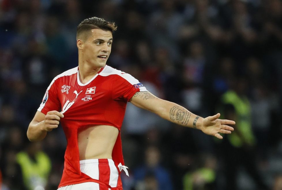Football Soccer - Switzerland v France - EURO 2016 - Group A - Stade Pierre-Mauroy, Lille, France - 19/6/16 Switzerland's Granit Xhaka has his shirt ripped after a challenge by France's Paul Pogba (not pictured) REUTERS/Gonzalo Fuentes Livepic