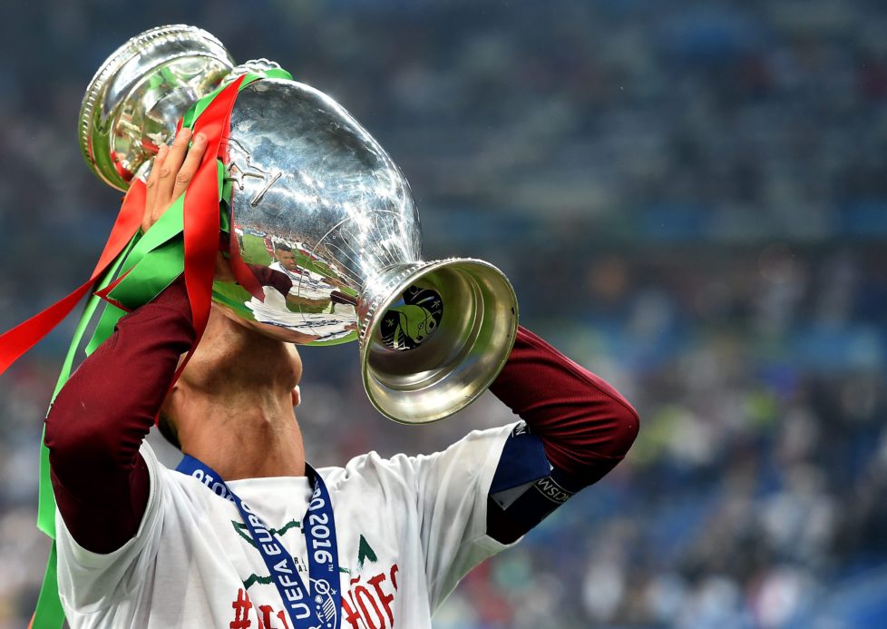 epa05419789 Cristiano Ronaldo of Portugal kisses the trophy after winning the UEFA EURO 2016 Final match against France at Stade de France in Saint-Denis, France, 10 July 2016. (RESTRICTIONS APPLY: For editorial news reporting purposes only. Not used for commercial or marketing purposes without prior written approval of UEFA. Images must appear as still images and must not emulate match action video footage. Photographs published in online publications (whether via the Internet or otherwise) shall have an interval of at least 20 seconds between the posting.) EPA/ETIENNE LAURENT EDITORIAL USE ONLY