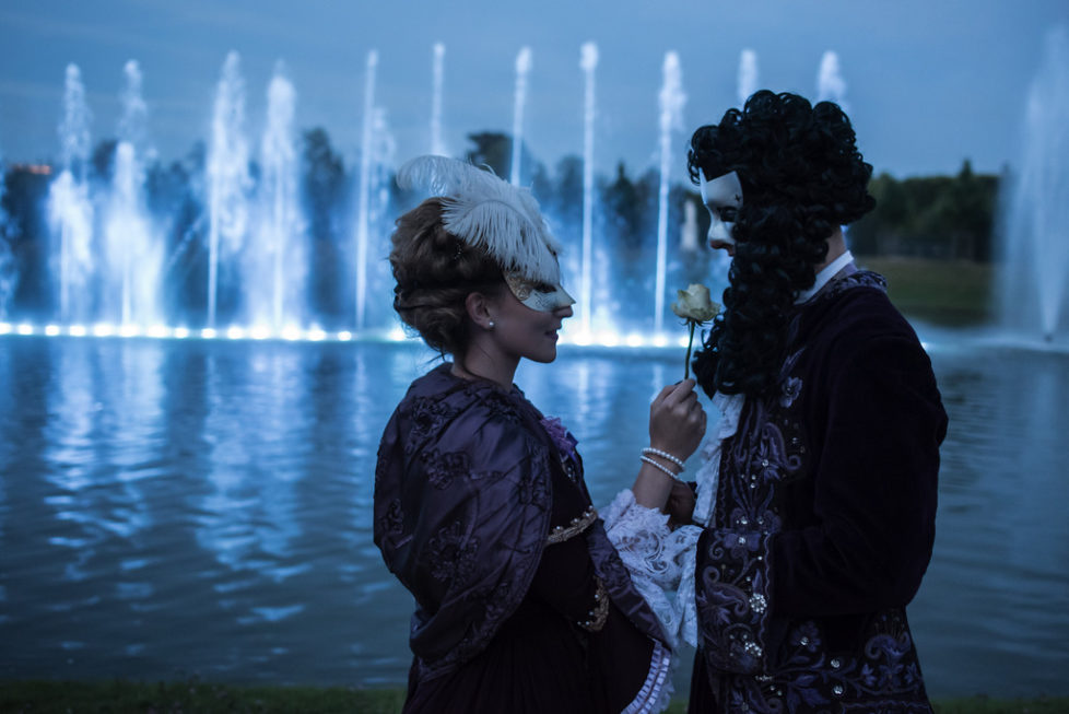 Gwendoline and Jordan stand in front a fountain in the gardens of the Versailles castle before the Great Masked Bal, in Versailles, west of Paris, Saturday, June 27, 2015. On the occasion of the tercentenary of King Louis XIVs death, who died on Sept.1, 1715, a fountains show and a costumed ball took place in the castle.(AP Photo/Kamil Zihnioglu)
