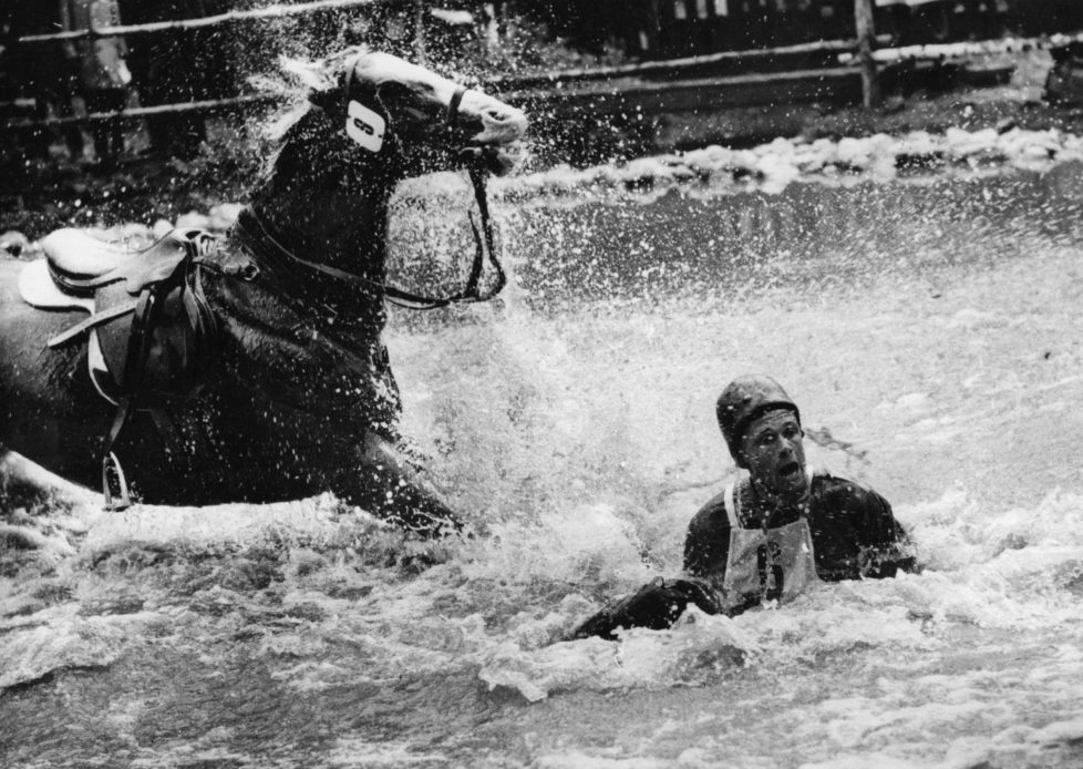 Finnish rider R A Kuistila in the water after falling from his horse during the Equestrian Olympic Games in Stockholm. (Photo by Keystone/Getty Images)