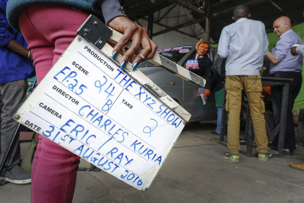 epa05548721 (03/19) A prodution assistant holds a clapperboard as she watches the shooting of the 11th season of 'The XYZ Show' satirical puppet show featuring the Donald Trump puppet at a studio in Nairobi, Kenya, 31 August 2016. The XYZ Show is Kenya’s popular satirical television program and has been taking pokes at the country’s political elites and international figures ever since it aired its first episode in 2009. With the 2016 US presidential elections, the show is now taking on Republican Presidential candidate Donald Trump. EPA/DAI KUROKAWA PLEASE REFER TO ADVISORY NOTICE (epa05548718) FOR FULL FEATURE TEXT